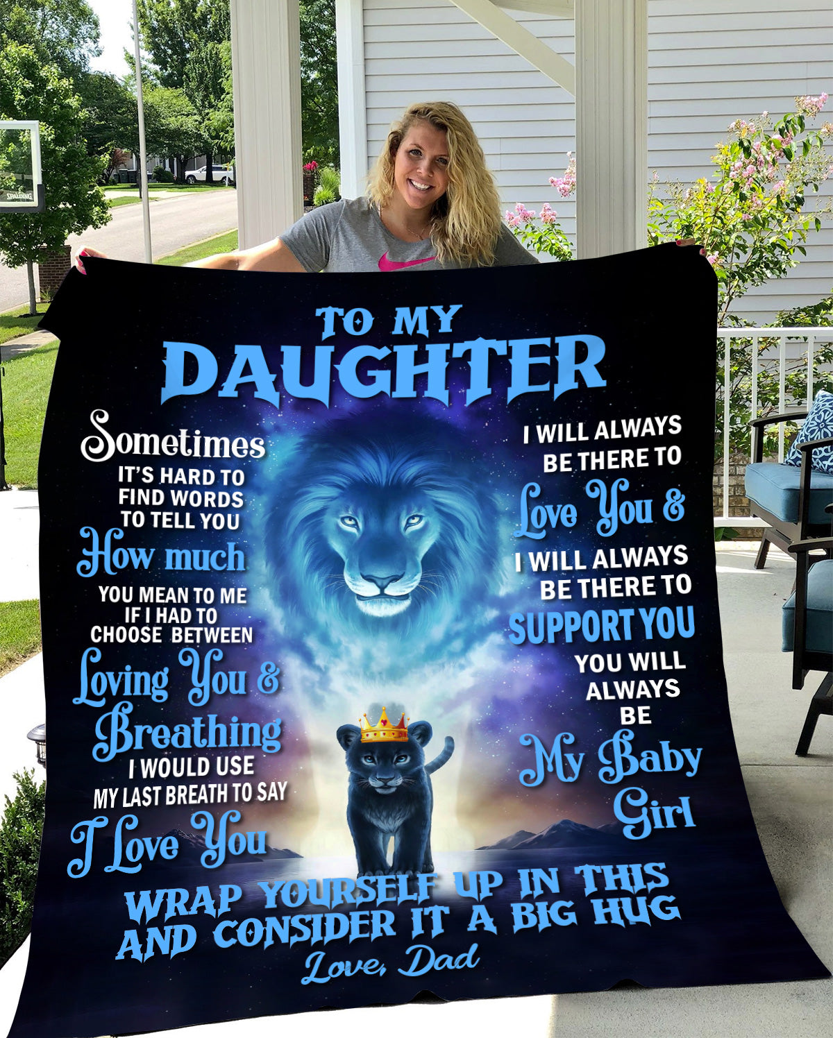 Lady holding up blanket for daughter from dad with blue lion and cub